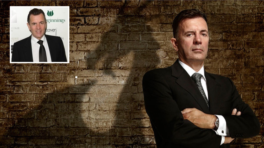 Photo of Duncan Bannatyne in front of Wall with smaller photo inset